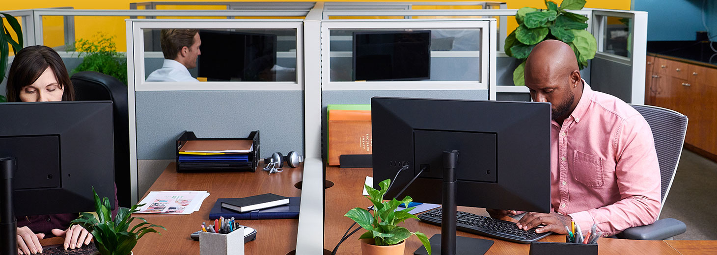 Man sitting behind a computer in an office