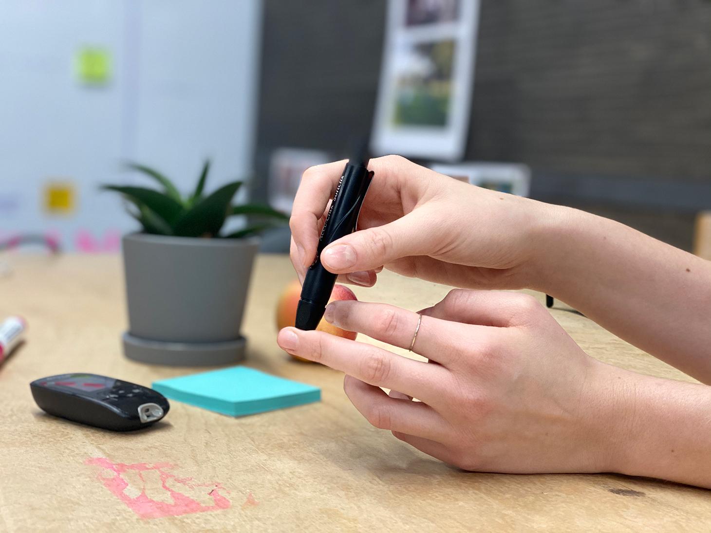 Woman pricking her fingers to measure her blood sugar