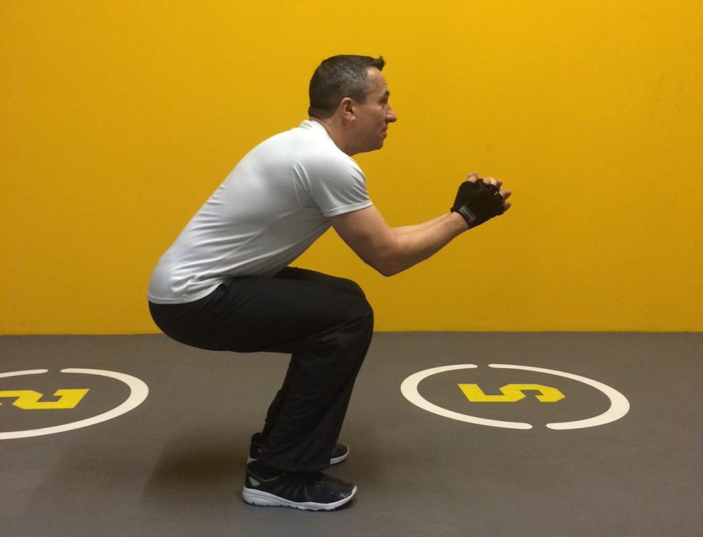 Man doing air squats
