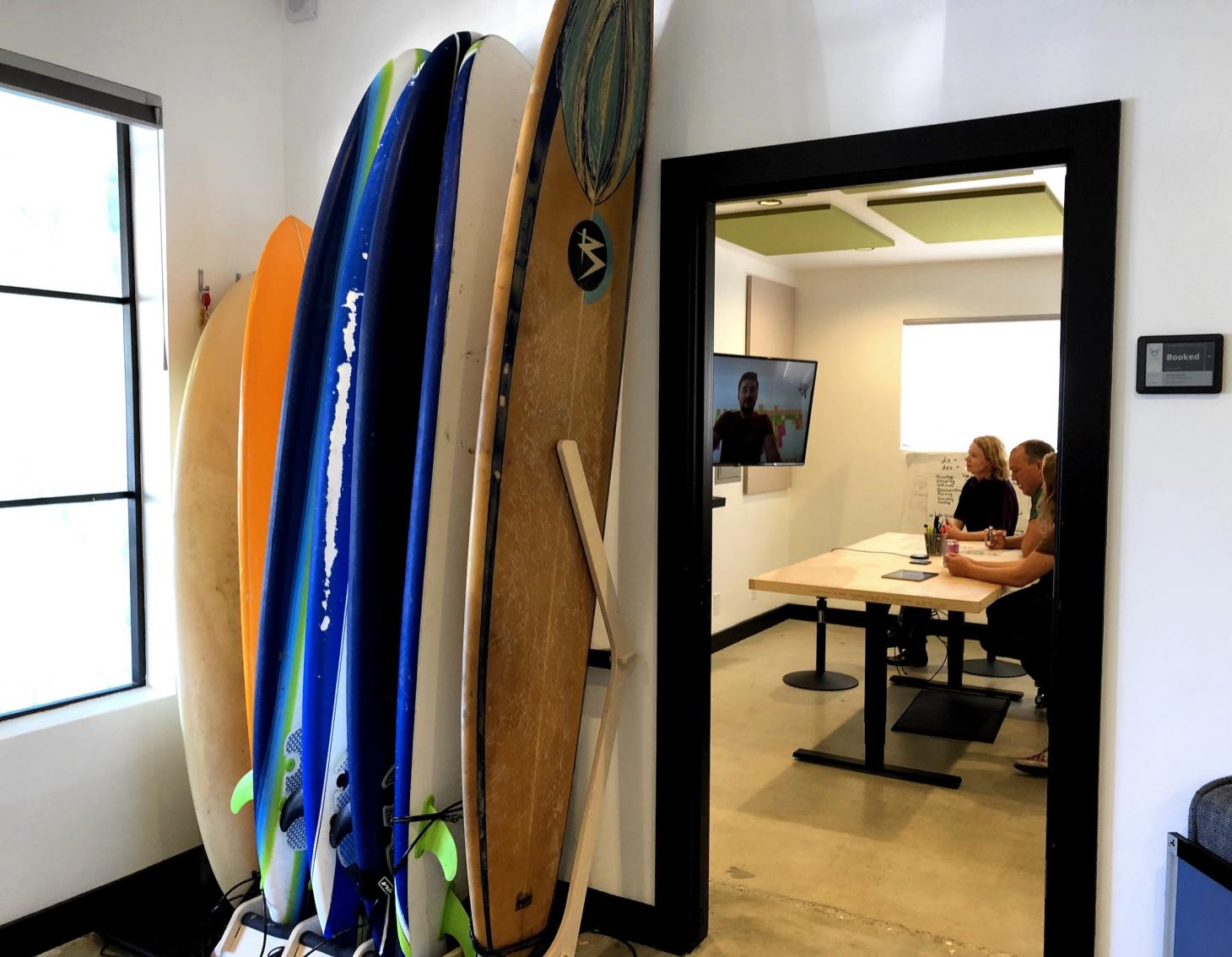 Surfboards in a rack by the office door
