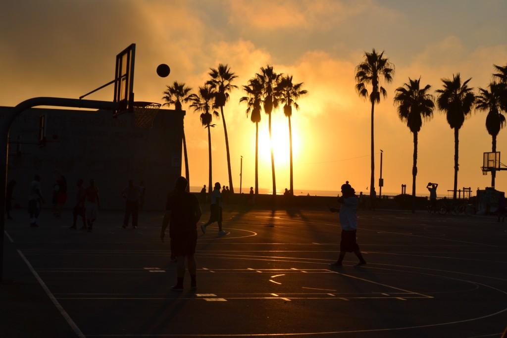 Guys playing basketball outside