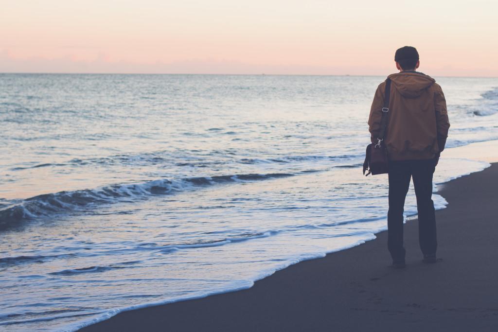 Unsettled man at the beach